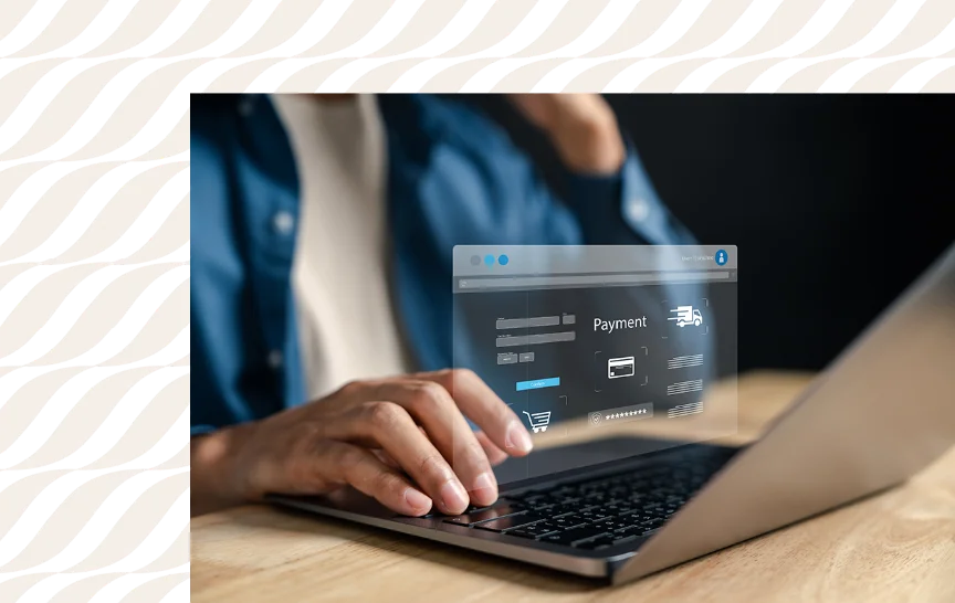 a person entering payment information on a laptop with a virtual payment display over the keyboard