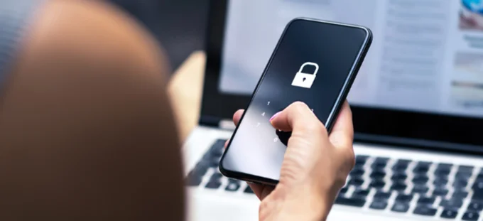A woman unlocking her phone to make an online payment